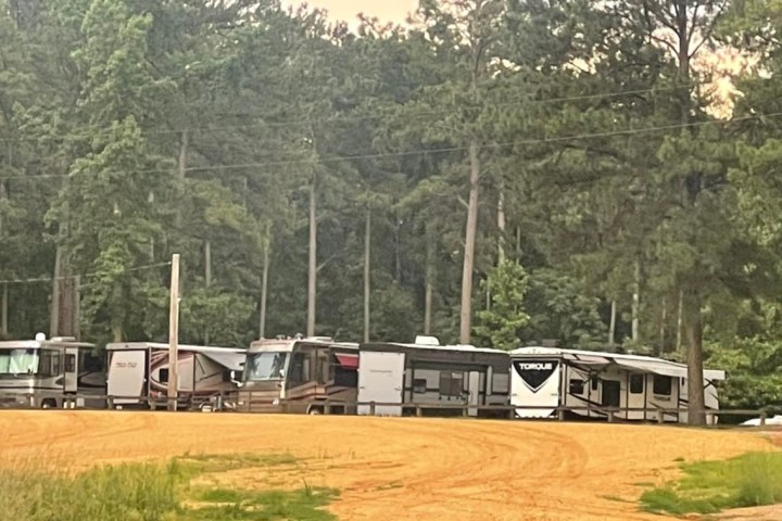 a bus traveling down a dirt road